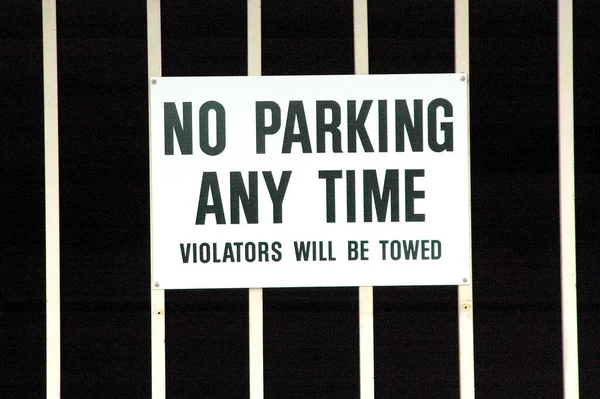 Closeup Parkiing Any Time Sign Posted Metal Fence — Fotografia de Stock