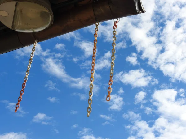 Low Angle Shot Hanging Chains Cloudy Sky — Stockfoto