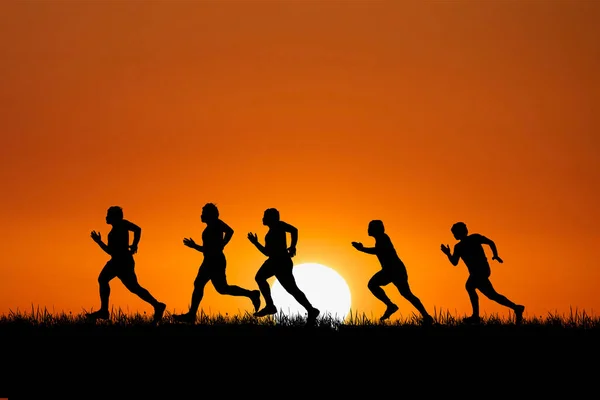 Silhouette Group Athletic People Exercising Running Shiny Sunset — Stockfoto