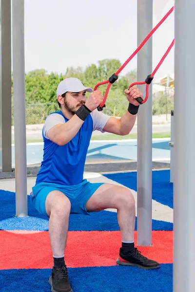 Man Exercising Fitness Suspension Straps — Photo