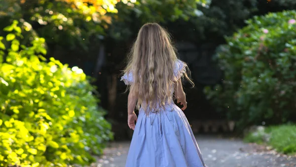 Back View Little Blonde Girl Wearing Dress Wandering Park — Zdjęcie stockowe