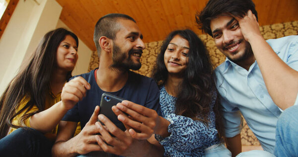 Group Indian Friends Watching Something Smartphone Stock Image