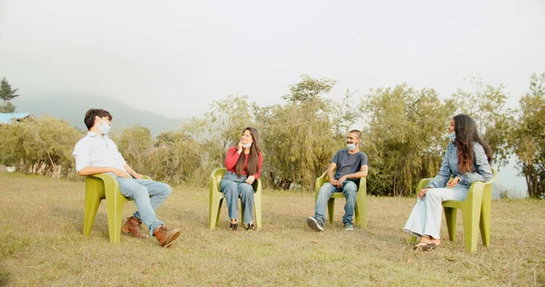 Meeting Four Colleagues Park Social Distancing Face Masks Stock Image