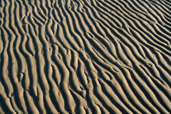 Ένα Κοντινό Πλάνο Της Άμμου Στο Έδαφος Κάτω Από Φως — Φωτογραφία Αρχείου