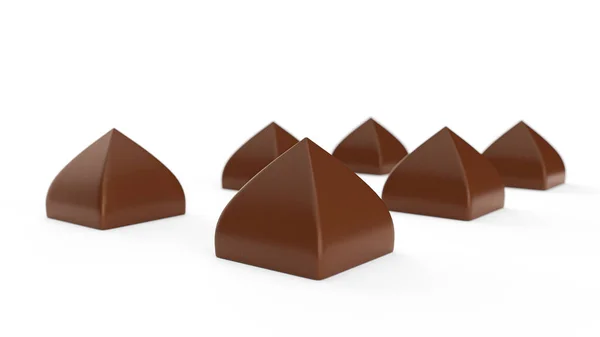 在白色背景上隔离的Somw金字塔形巧克力糖果 — 图库照片