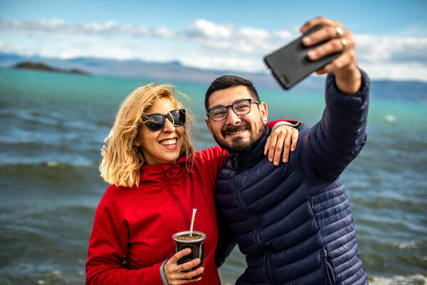 Shallow Focus Smiling Argentinian Couple Taking Selfie Beach Windy Day Stock Picture