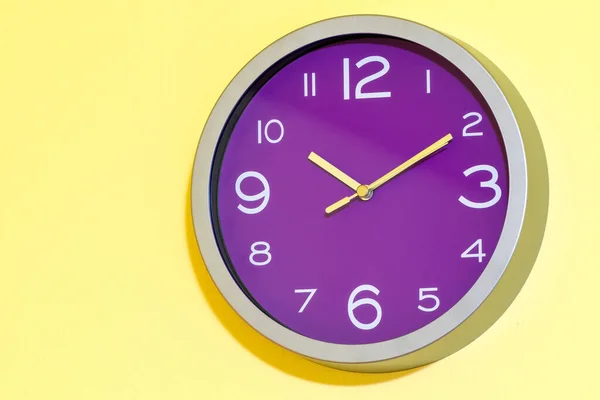 Shot Indoor Purple Wall Clock Yellow Background — Stock Photo, Image