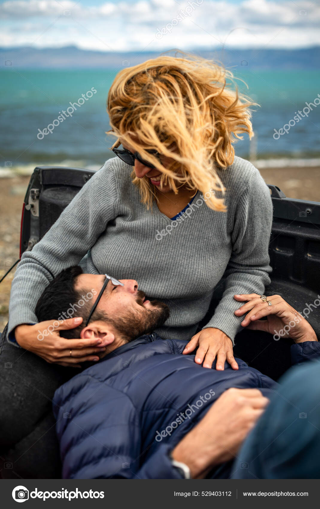 Lovely Cheerful Argentinian Couple Cuddling Cargo Bed Truck Car