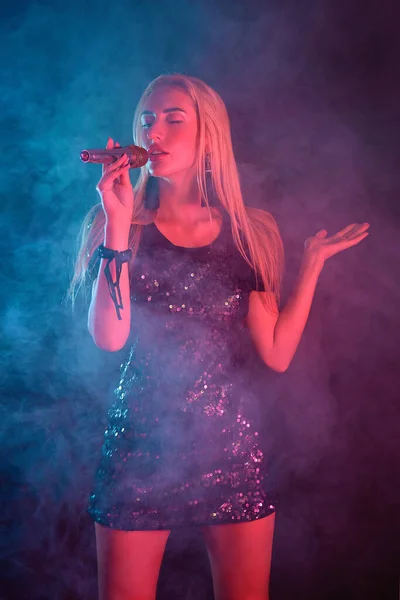 Young Sexy Blonde Female Singer Holding Microphone — Stock Photo, Image