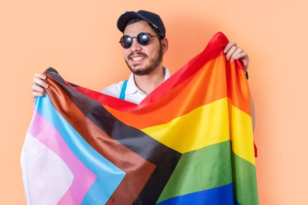 Young Hipster Sunglasses Holding Progress Pride Community Flag — стоковое фото