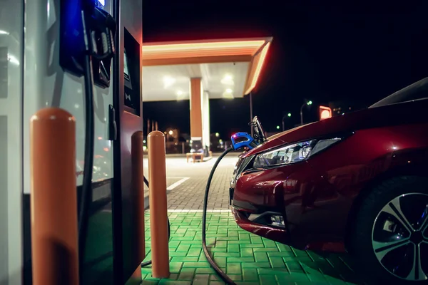 Charging Red Electric Cars Parking Lot Charging Station Charger Plugs — Zdjęcie stockowe