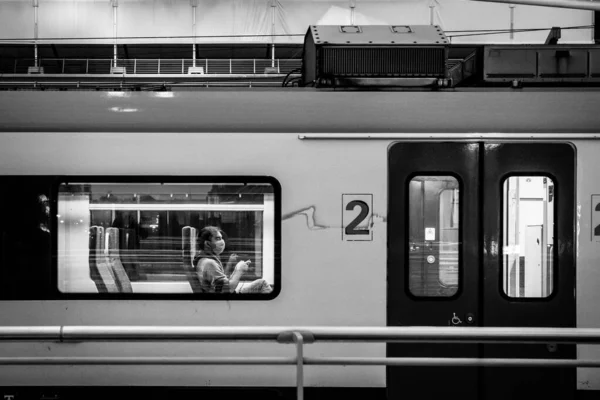 Grayscale Shot Stopped Train Station Person Sitting — Stok fotoğraf