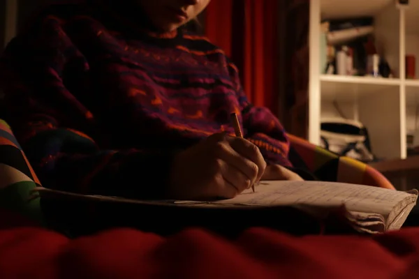 Closeup Girl Writing Her Notebook Doing Her Homework Sitting Her — Zdjęcie stockowe