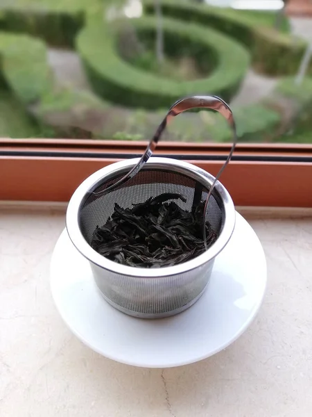 Closeup Shot Fresh Wet Tea Leaves Metal Tea Filter Windowsill — Photo