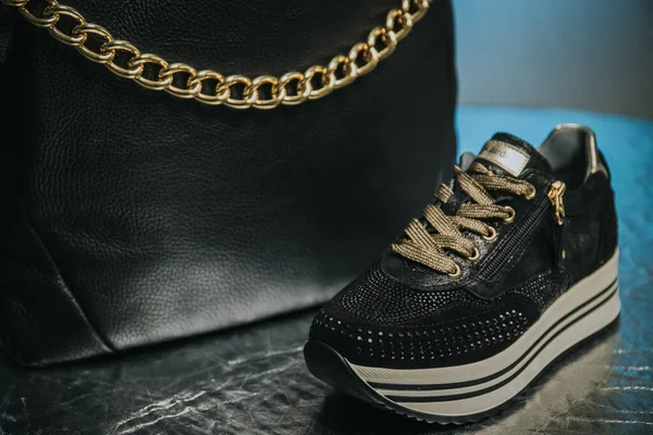 Closeup Black Sneaker Rhinestones Next Black Leather Handbag — Photo