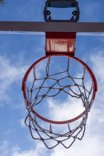 Vertical Low Angle Shot Basketball Ring Cloudy Sky —  Fotos de Stock