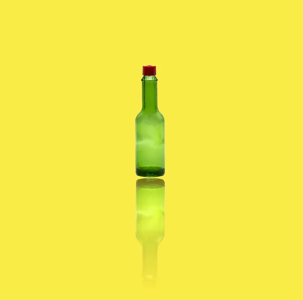 Vertical Shot Empty Green Bottle Isolated Yellow Background — Stock Photo, Image