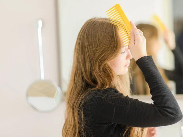 Young Ginger Haired Caucasian Girl Brushing Her Hair Mirror — Photo