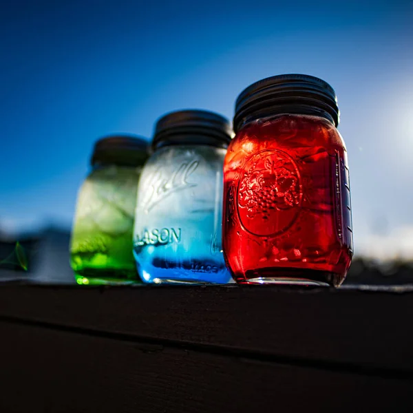 Three Different Colored Water Jars Balcony — Stockfoto