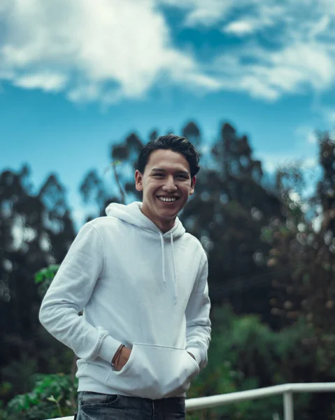 Young Colombian Male Wearing White Sweater Smiling Posing Trees — 스톡 사진