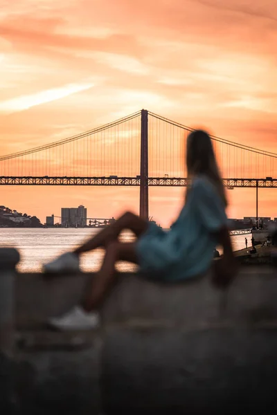 Blurry View Woman Sitting Wall Looking Ponte Abril Portugal — Stock Photo, Image