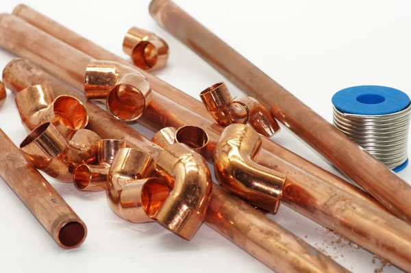 Closeup Shot Copper Metal Pieces Construction White Surface — Stock Photo, Image