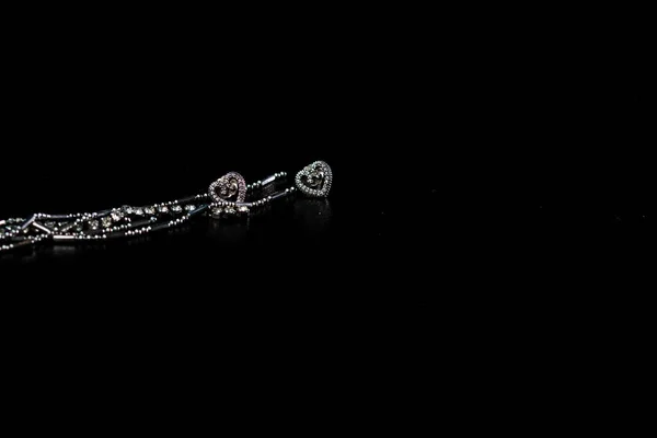 Closeup Pair Elegant Silver Earrings Heart Pendants Isolated Black Background — Stock Photo, Image