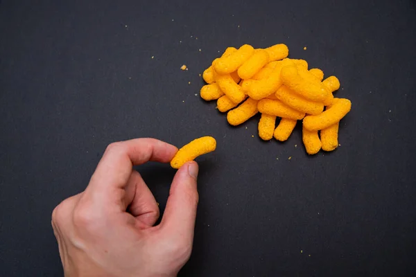 Top View Person Taking Cheese Puff Black Surface — Stock Photo, Image