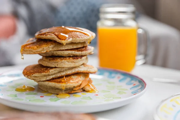 Stack Pancakes Dripping Maple Syrup Glass Fresh Orange Juice — Stock fotografie