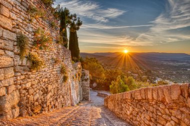 A fascinating view of the sunrise in Gordes, France clipart