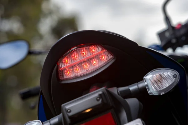 Closeup Tail Lights Modern Motorcycle Outdoors Blurry Background — Stock fotografie