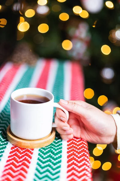 Vertical Closeup Shot Hand Holding Cup Coffee Christmas Table — Stockfoto