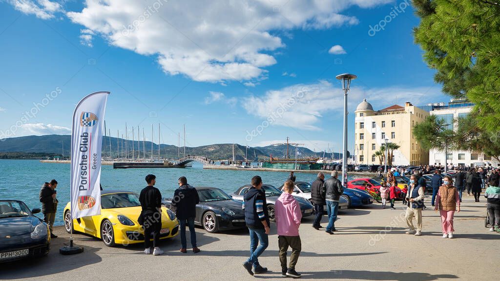 VOLOS, ALGERIA - Nov 28, 2021: Porsche supercars, The Porsche club of Greece on an excursion to the beautiful city of Volos, 60 wonderful Porsche brand cars on seafront of Volos