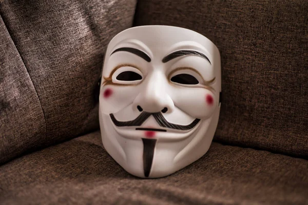 Guy Fawkes Mask On A Wooden Background Stock Photo - Download