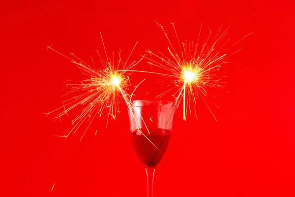Closeup Glass Red Wine Sparklers Isolated Red Background — Stockfoto