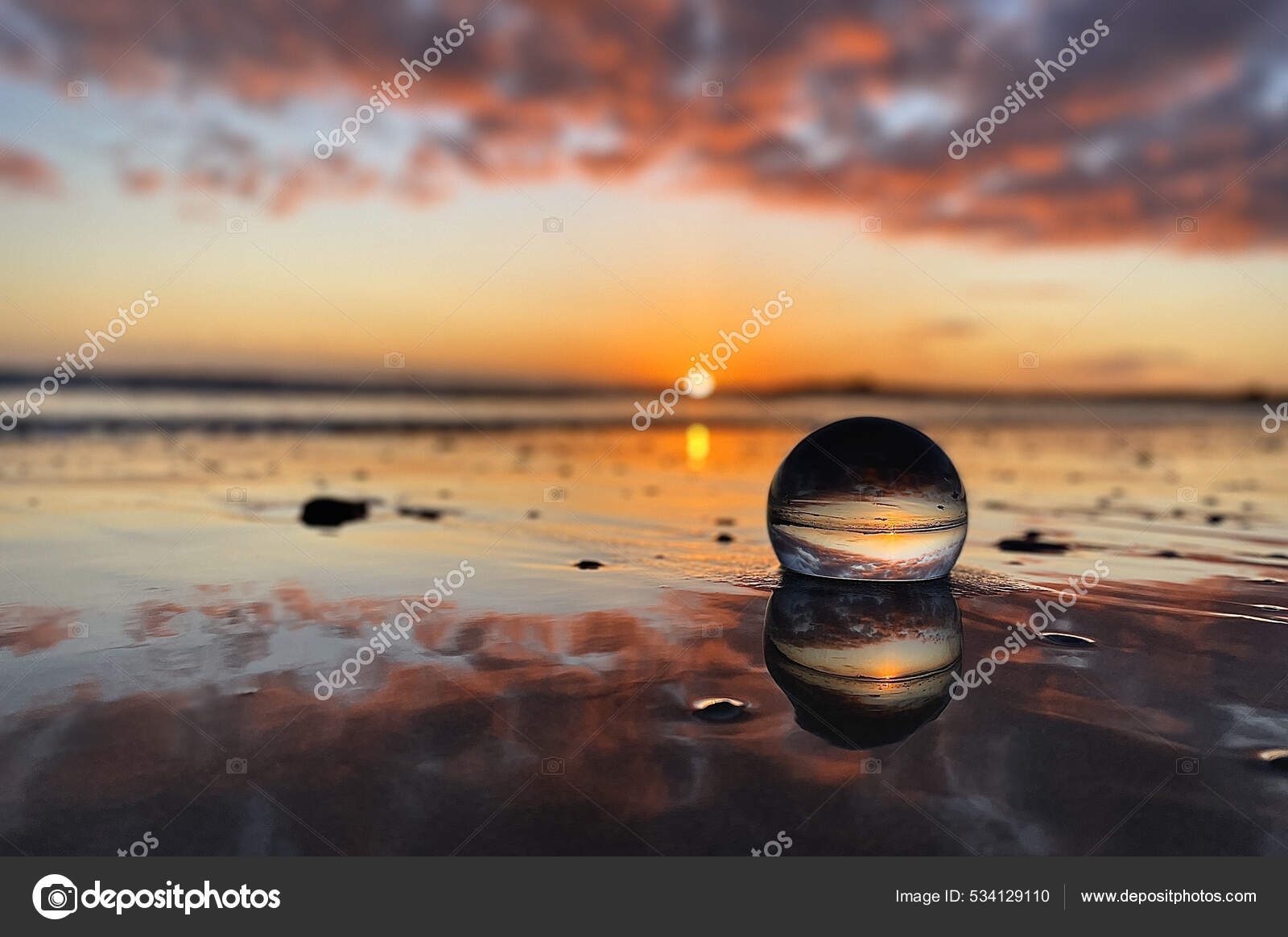 Glass Ball Beach Reflecting Ocean Sunset — Stock Photo © Wirestock  #534129110