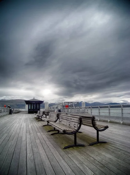 Vertical Shot Benches Pier Cloudy Day — ストック写真