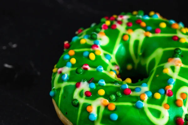 Yummy Green Glazed Donut Topped Sprinkles Isolated Black Background — Stock Fotó