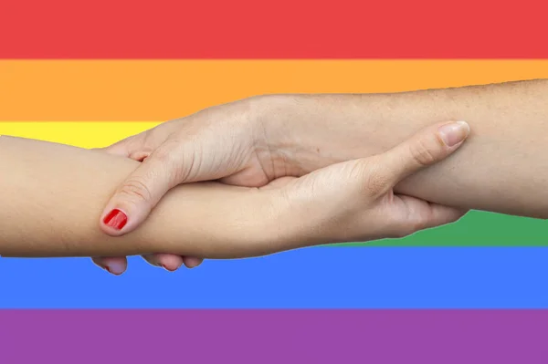 Closeup Shot Holding Hands Lgtb Flag Background — Stock Photo, Image