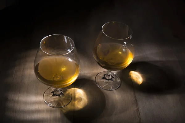 High Angle Shot Two Glasses Brandy Wooden Table — Stock Fotó
