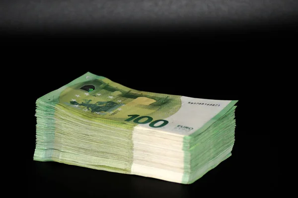 Closeup One Hundred Euros Bills Isolated Black Background — Stock Fotó