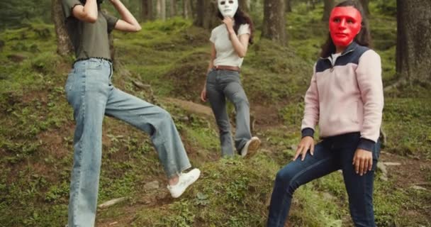 Group Female Friends Spending Time Together Forest Wearing Carnival Masks — стоковое видео