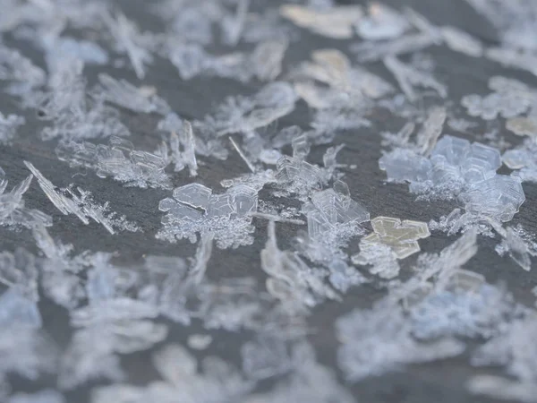 Detailní Záběr Plastových Sněhových Vloček Šedém Povrchu — Stock fotografie