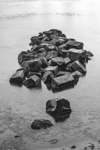 Greyscale Shot Pile Heavy Black Rocks Water River — Stock Photo, Image