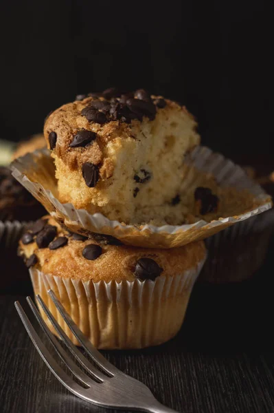 Vertical Closeup Shot Delicious Vanilla Muffins Chocolate Chips Black Background — стоковое фото