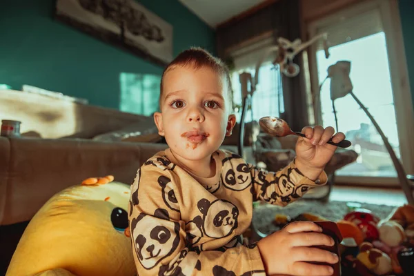 Portrait Cute Toddler Dirty Mouth Eating Chocolate Spoon — Fotografia de Stock