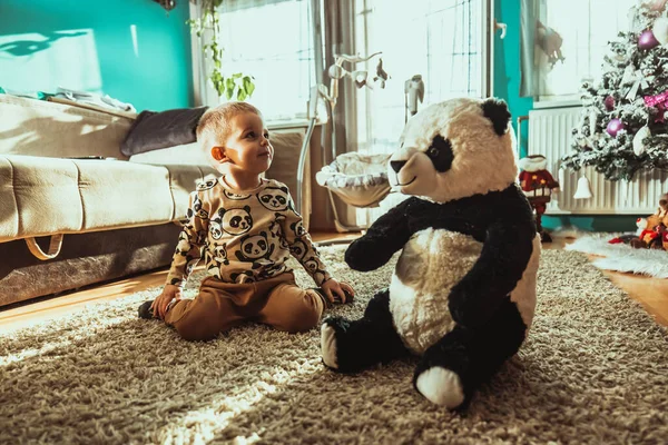 Adorable Toddler Playing Teddy Bear Floor Sunny Room — Fotografia de Stock