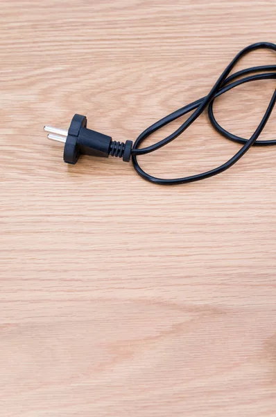 Isolated Electrical Power Cord Plug Wooden Background Copy Space — Fotografia de Stock