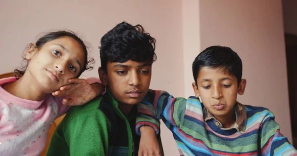 Shallow Focus Three Bored South Asian Siblings Staying Indoors — стоковое фото