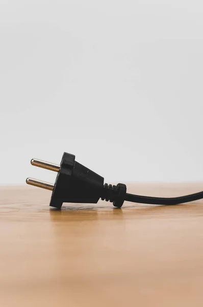 Isolated Electrical Power Cord Plug Wooden Background Copy Space — Fotografia de Stock